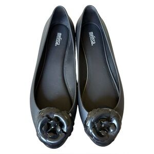Melissa Black Flats with Glossy Finish and Decorative Medallion